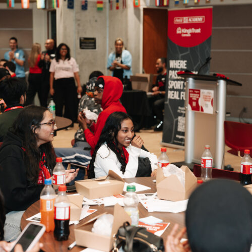 Group of youth gather at a table for a fun, free event in Toronto.